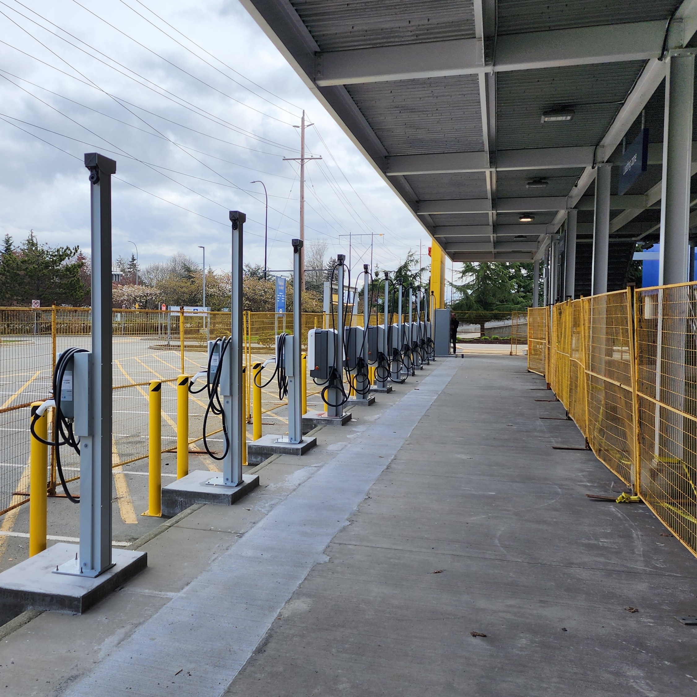 EV charging kiosks installed in an outdoor parking lot.